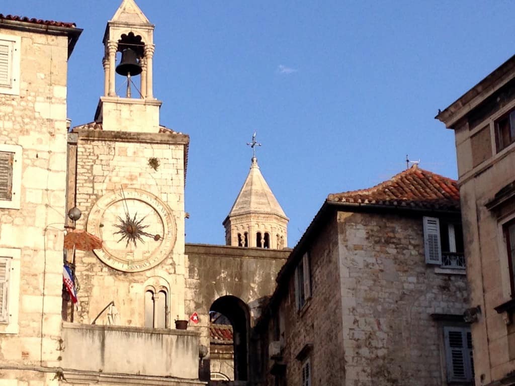 Plaza clock tower outside the Silver Gate with St. Dominius bell tower beyond