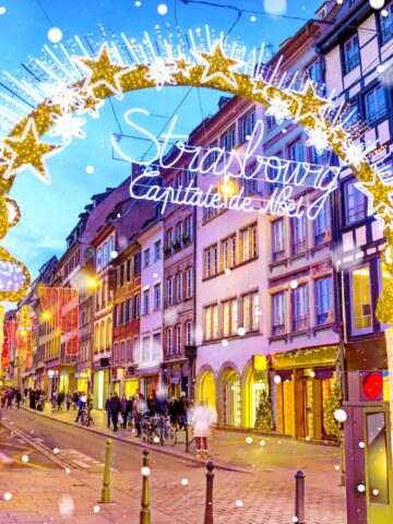 Entrance gate with illumination decorations to the Christmas Market in Strasbourg - capital of Noel, Alsace, France.