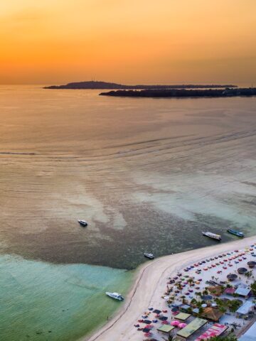 Aerial view of a beautiful tropical sunset and sandy beach (Gili Islands, Indonesia)